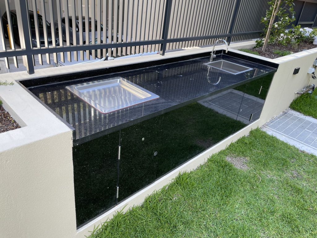 Inbench Greenplate BBQ installed in custom granite cabinet