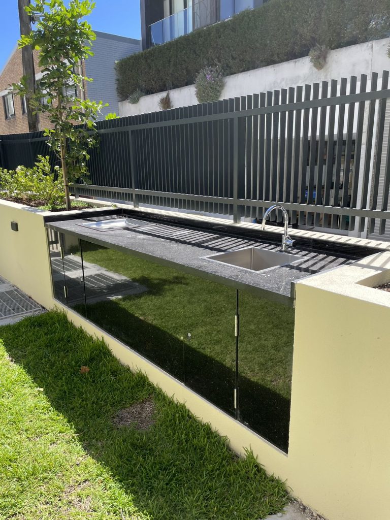 Inbench Greenplate BBQ installed in custom granite cabinet